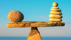 stone version of weighing scales denoting that google ads returns outweigh the investment